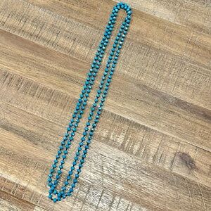 17.24” (when folded) blue faceted necklace